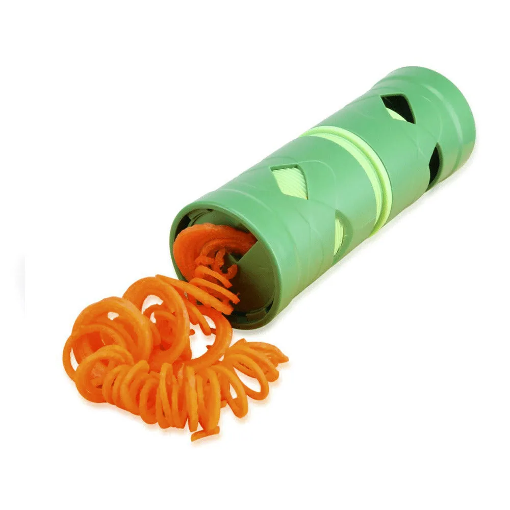 Green cylindrical vegetable twist slicer with orange carrot spirals emerging from one end