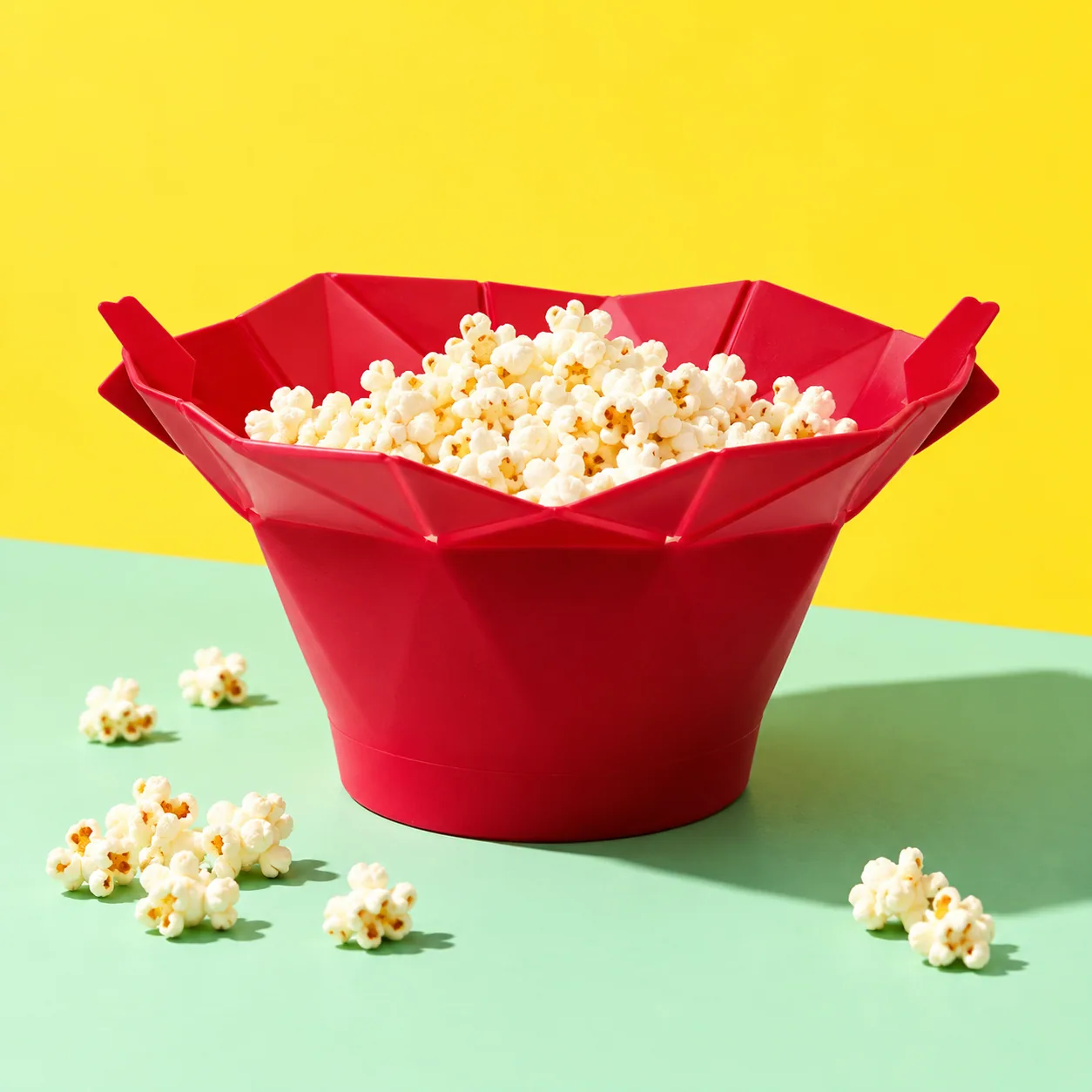 Fold-open popcorn maker — creative colour-blocked product image
